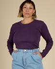 Tiara wearing the Nebula Long Sleeve Baby Tee tucked in