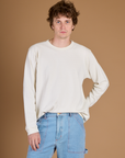 Quinn wearing the Vintage Tee White Long Sleeve Burly Tee tucked in