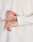 Close up of the Vintage Tee White Long Sleeve Burly Tee's sleeves worn by Quinn
