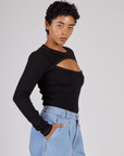 Side view of Mika wearing the Black Porthole Long Sleeve Tee