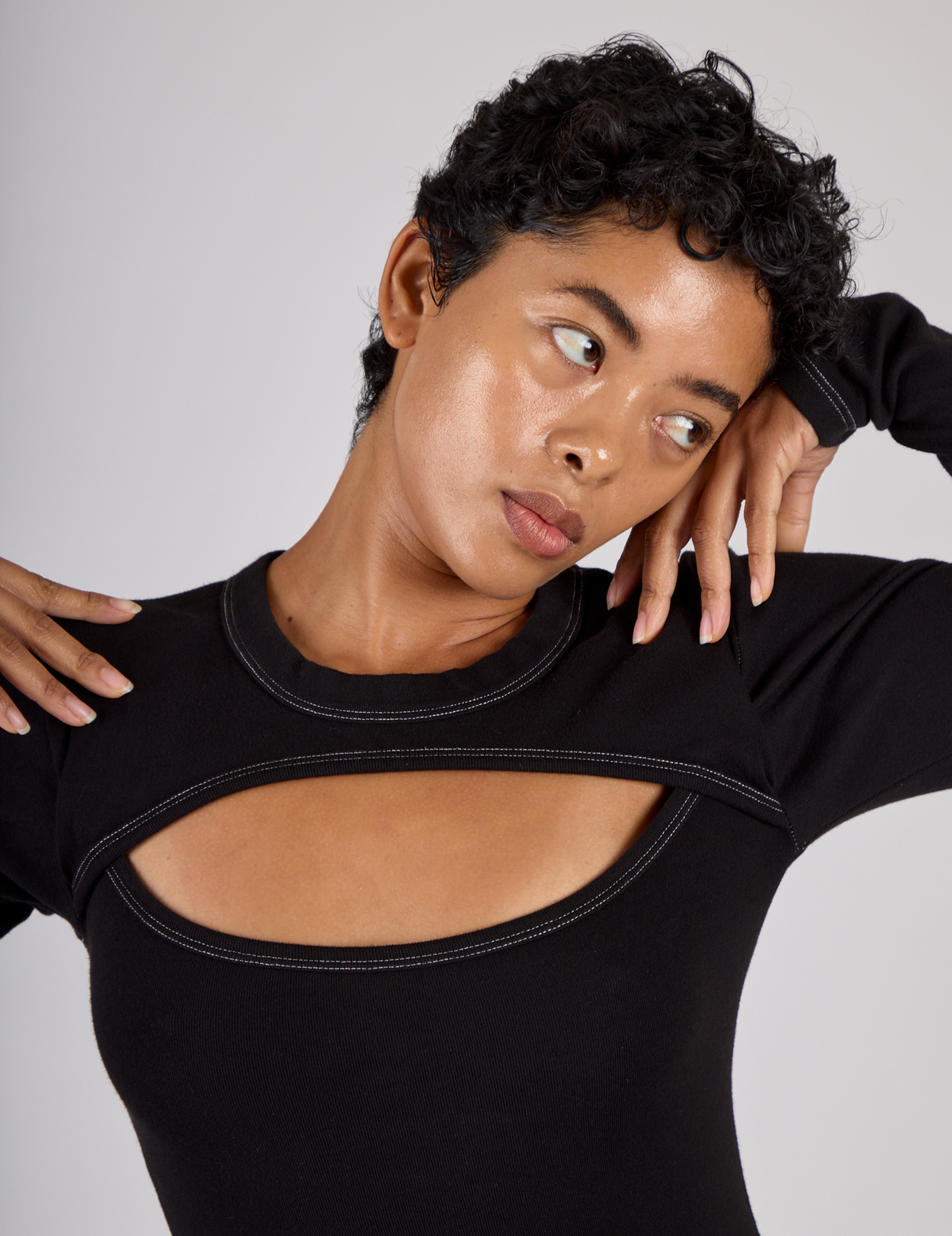 Close up of Mika wearing the Black Porthole Long Sleeve Tee