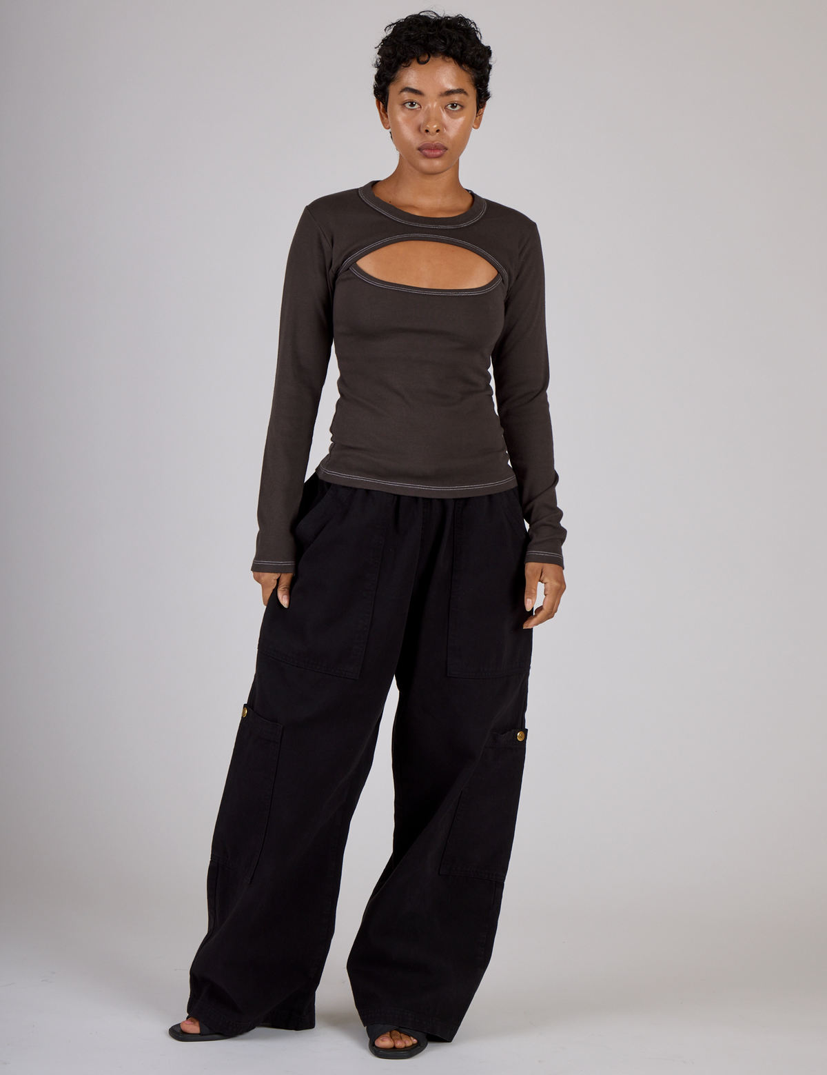 Mika wearing the Espresso Brown Long Sleeve Porthole Tee with Black Drop Pocket Pants