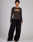 Mika wearing the Espresso Brown Long Sleeve Porthole Tee with Black Drop Pocket Pants