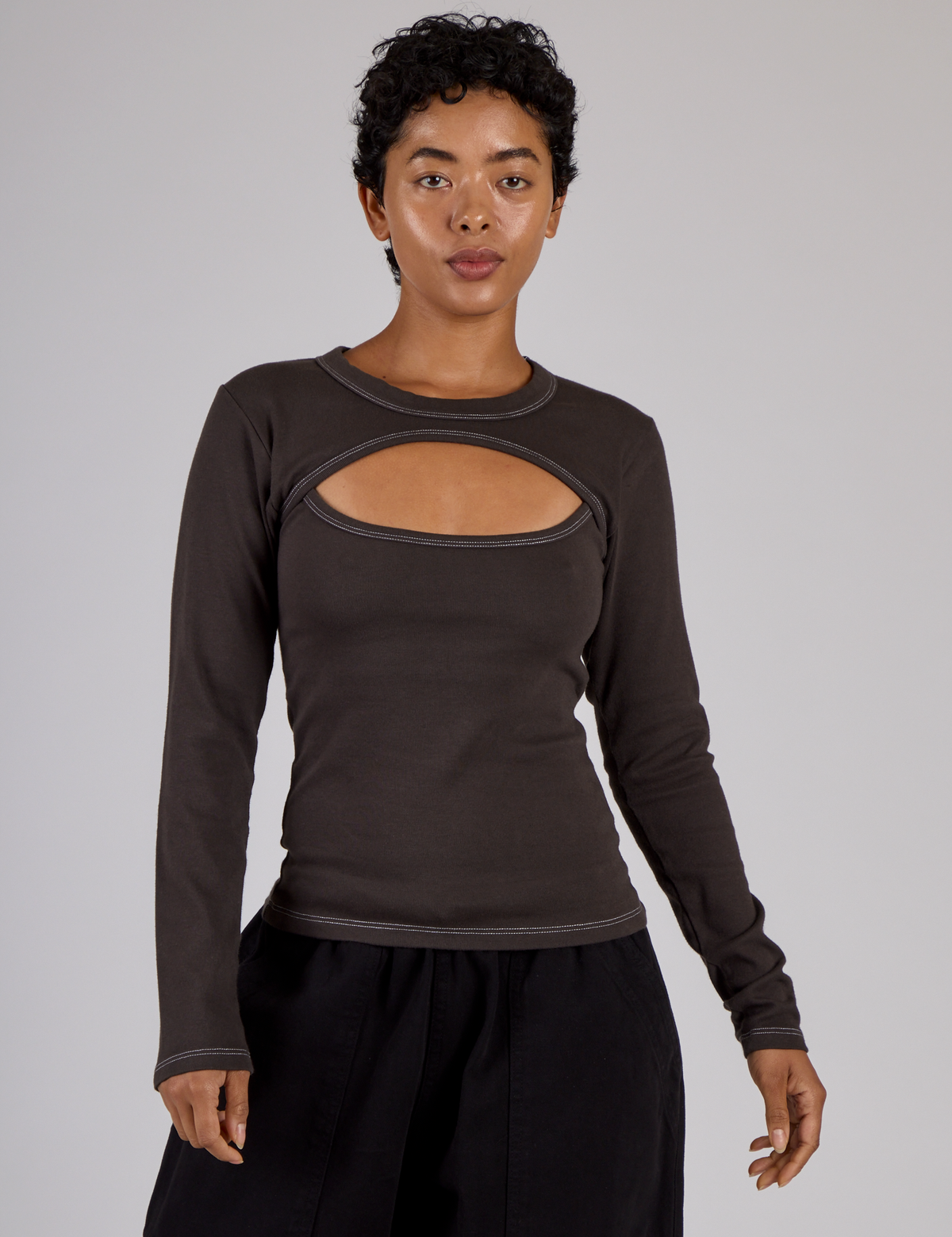 Mika is 5'3" and wearing P Espresso Brown Long Sleeve Porthole Tee