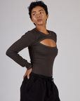 Side view of Mika wearing the Espresso Brown Long Sleeve Porthole Tee