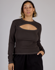 Tiara is 5'4" and wearing XS Espresso Brown Long Sleeve Porthole Tee