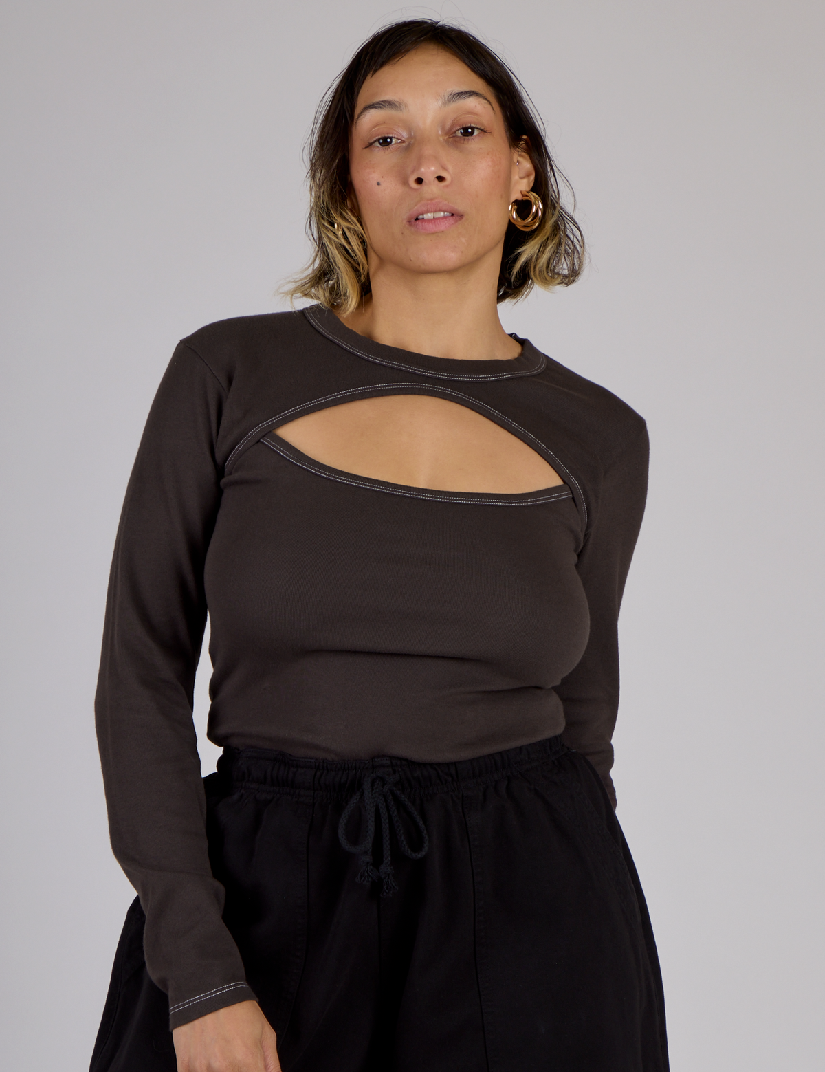 Tiara wearing the Espresso Brown Long Sleeve Porthole Tee tucked in
