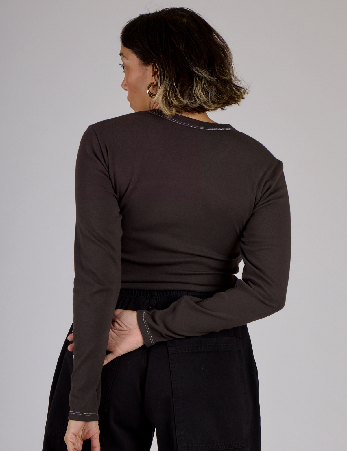 Back view of Tiara wearing the Espresso Brown Long Sleeve Porthole Tee