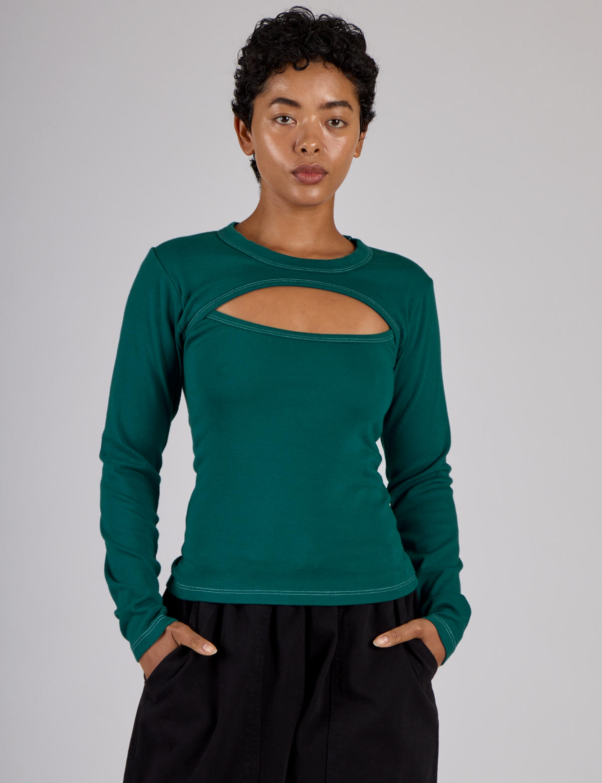 Mika is 5'3 and wearing P Hunter Green Long Sleeve Porthole Tee