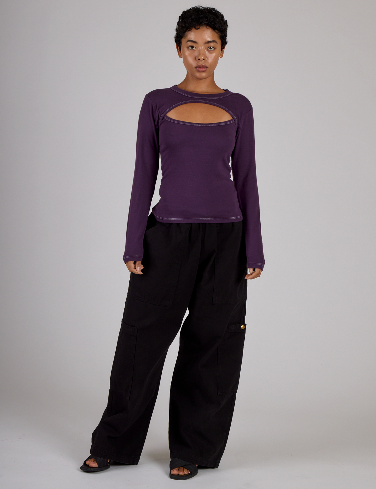 Mika wearing the Nebula Purple Long Sleeve Porthole Tee with Black Drop Pocket Pants