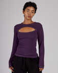 Mika is 5'3" and wearing P Nebula Purple Long Sleeve Porthole Tee