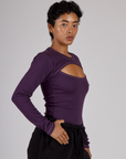 Side view of Mika wearing the Nebula Purple Long Sleeve Porthole Tee