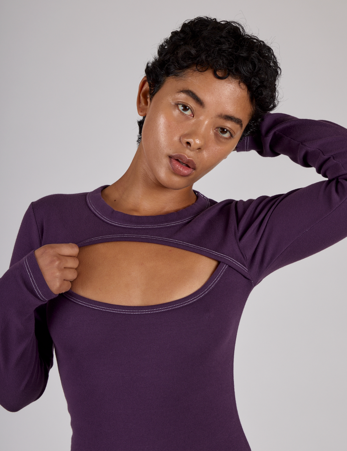 Close up of Mika wearing the Nebula Purple Long Sleeve Porthole Tee