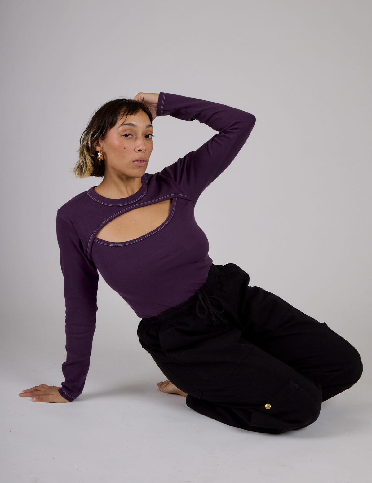 Tiara wearing the Nebula Purple Long Sleeve Porthole Tee with Black Drop Pocket Pants