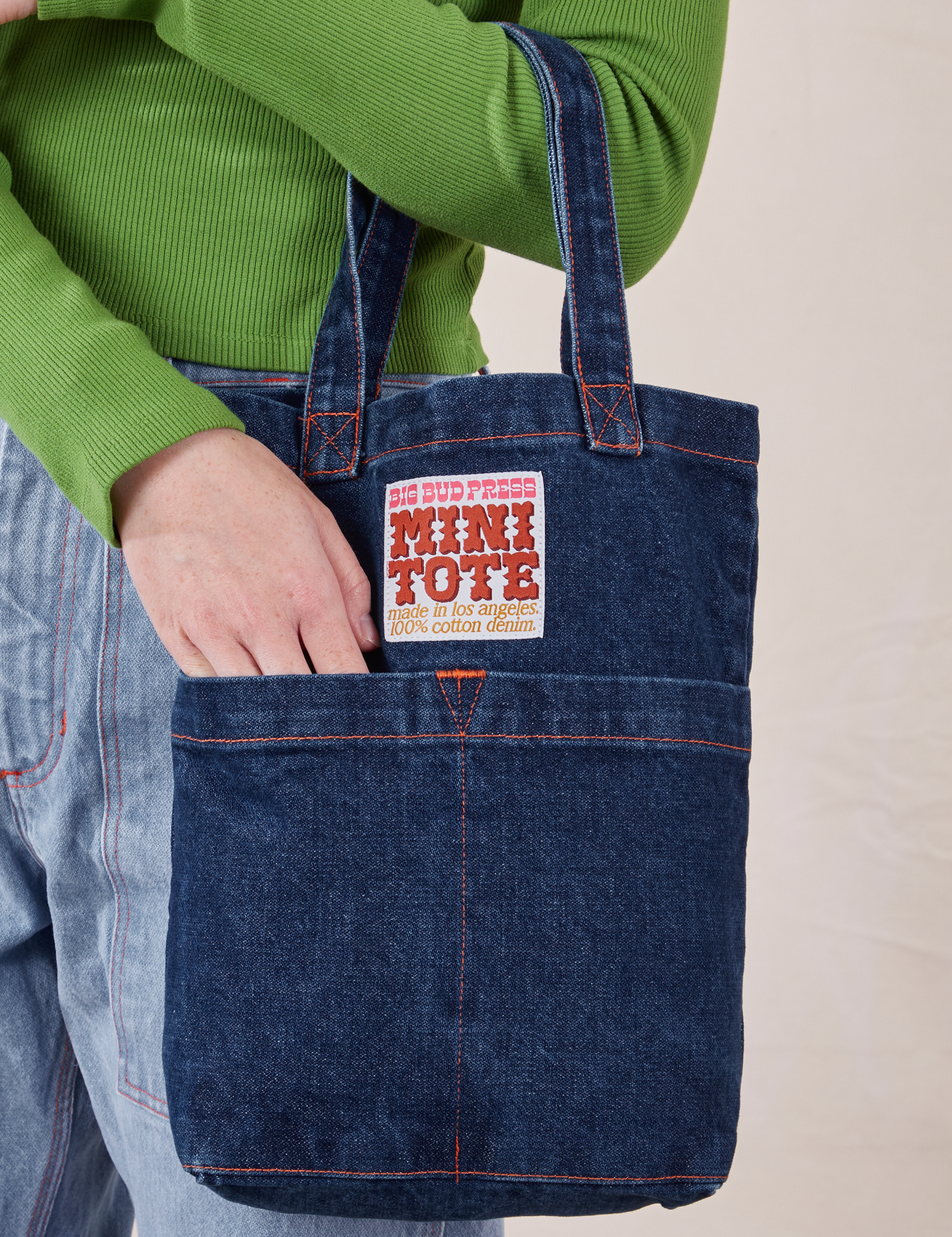 Denim Mini Tote Bag in Dark Wash on model's arm