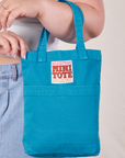 Mini Tote in Hawaiian Blue on Ashley's arm