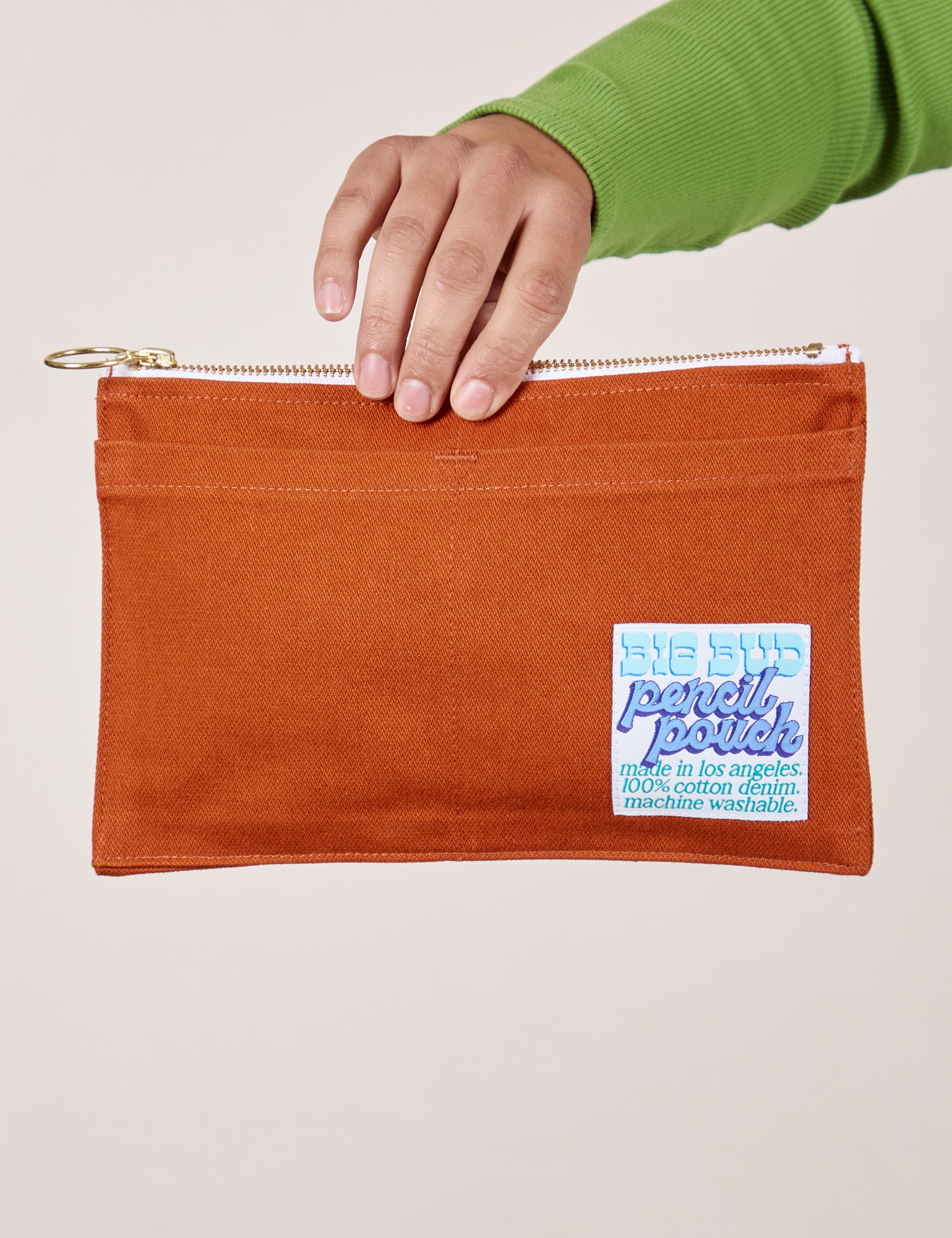 Pencil Pouch in Burnt Terracotta held by model