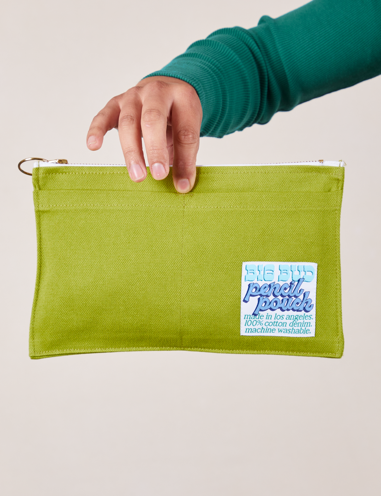 Pencil Pouch in Gross Green held by model