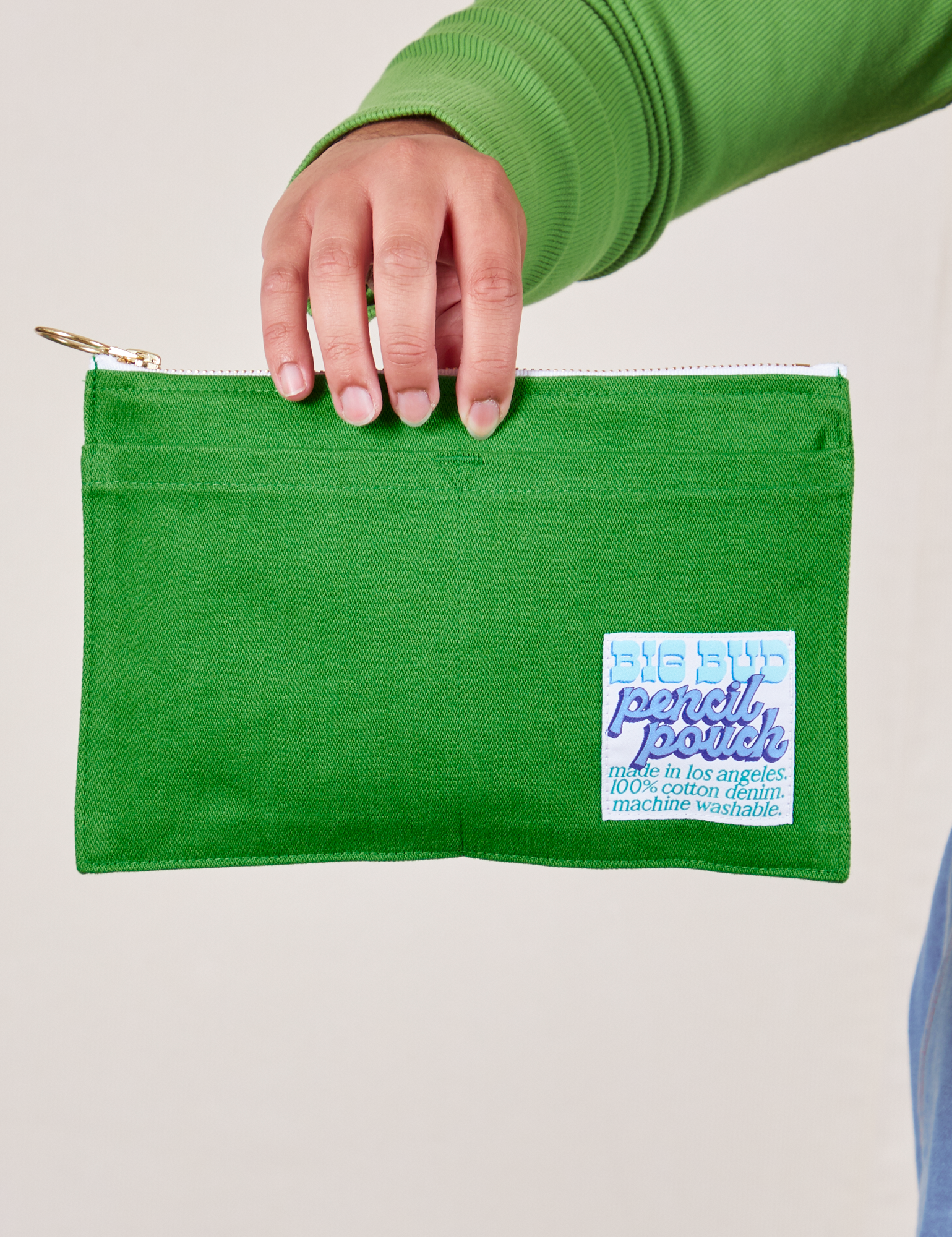 Pencil Pouch in Kelly Green held by model
