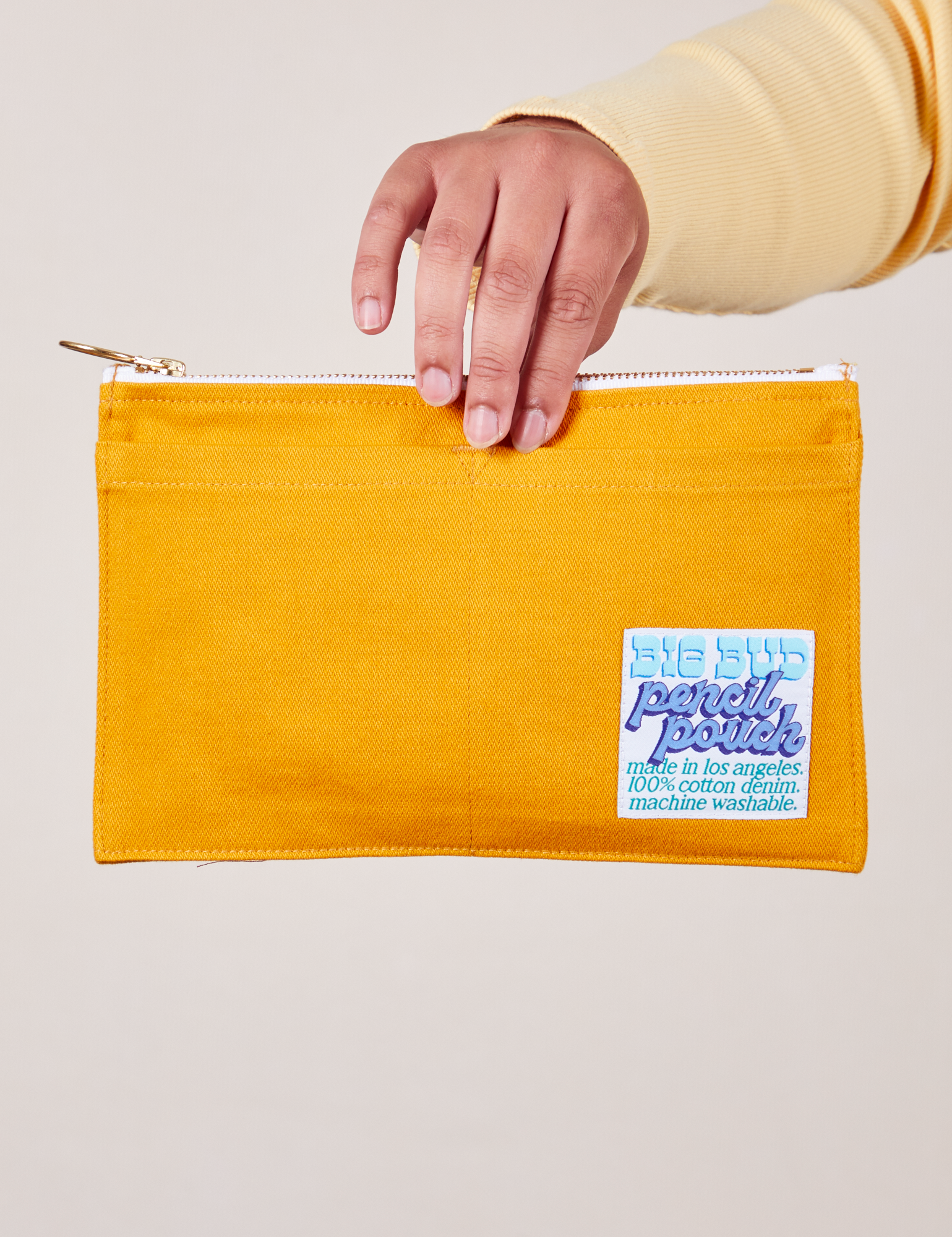 Pencil Pouch in Mustard Yellow held by model