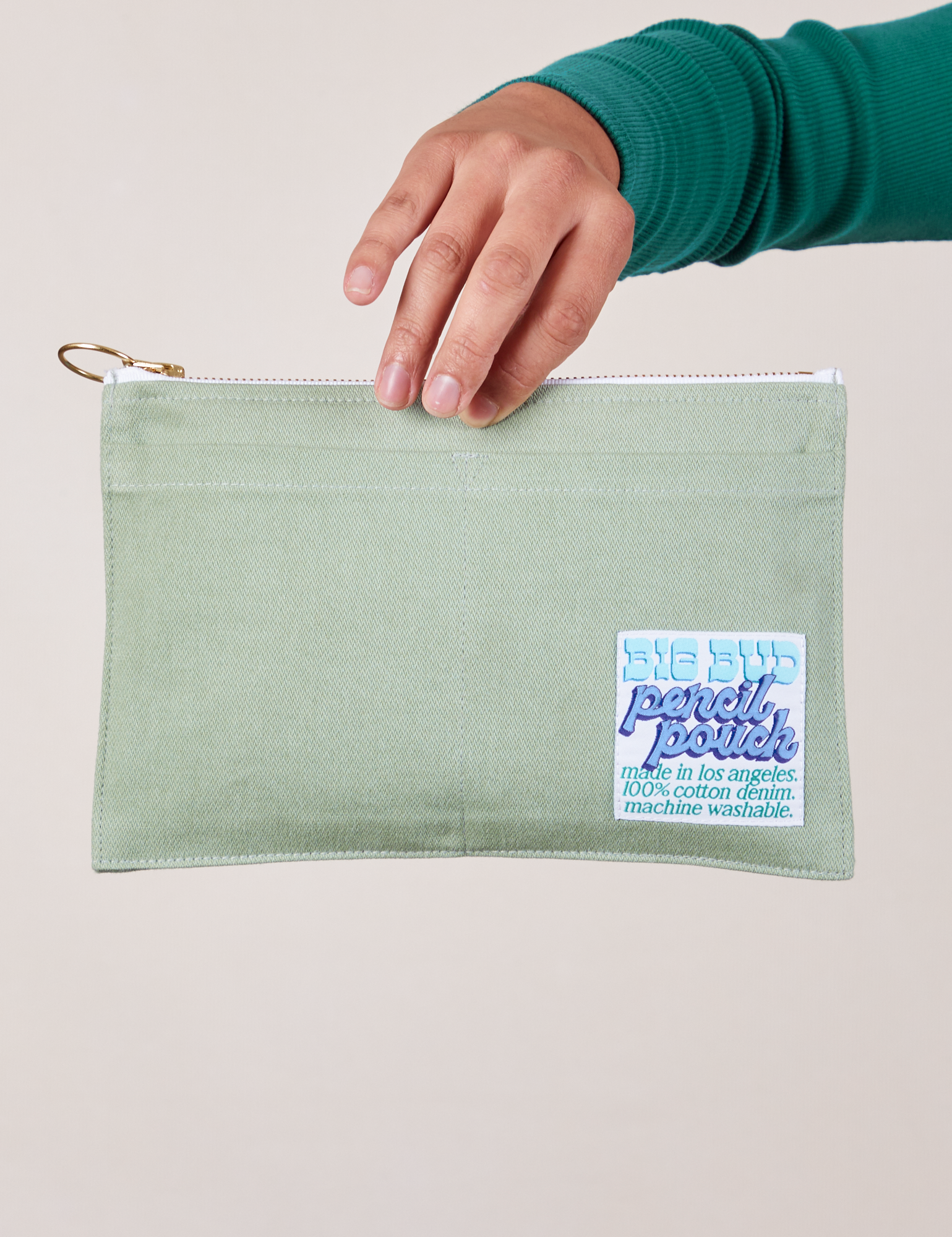 Pencil Pouch in Sage Green held by model