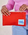 Pencil Pouch in mustang red held by model