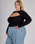 Side view of Juliet wearing the Black Porthole Long Sleeve Tee