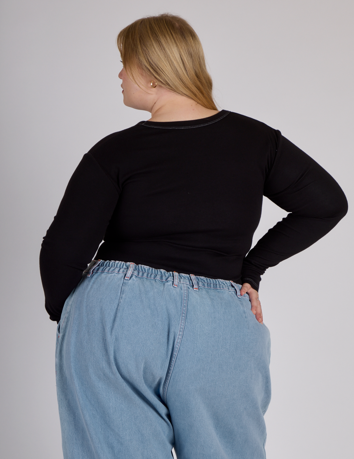 Back view of the Black Porthole Long Sleeve Tee on Juliet