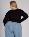 Back view of the Black Porthole Long Sleeve Tee on Juliet