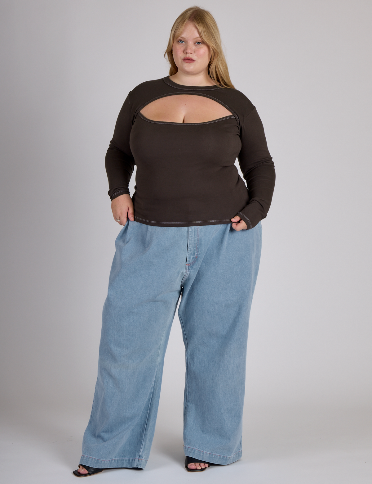 Juliet is 5'7" and wearing L Espresso Brown Long Sleeve Porthole Tee with Light Wash Wide Leg Denim Trousers