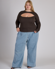 Juliet is 5'7" and wearing L Espresso Brown Long Sleeve Porthole Tee with Light Wash Wide Leg Denim Trousers