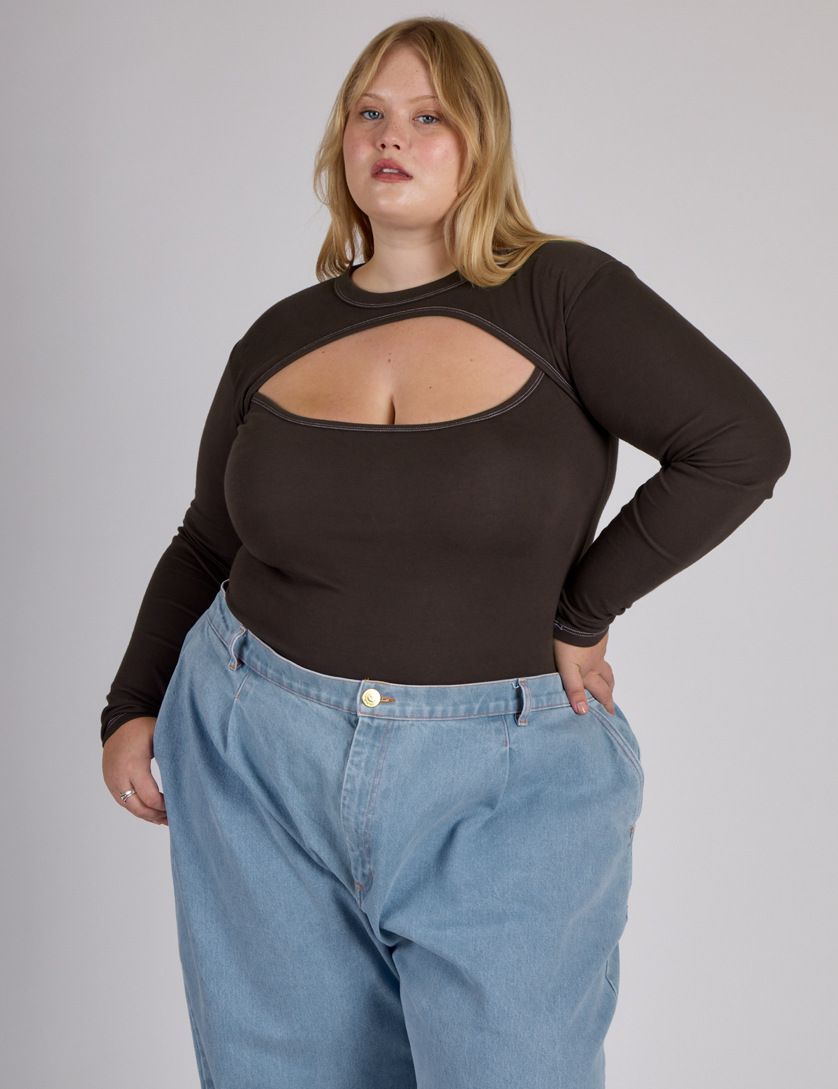 Juliet wearing the Espresso Brown Long Sleeve Porthole Tee tucked in