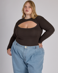 Juliet wearing the Espresso Brown Long Sleeve Porthole Tee tucked in