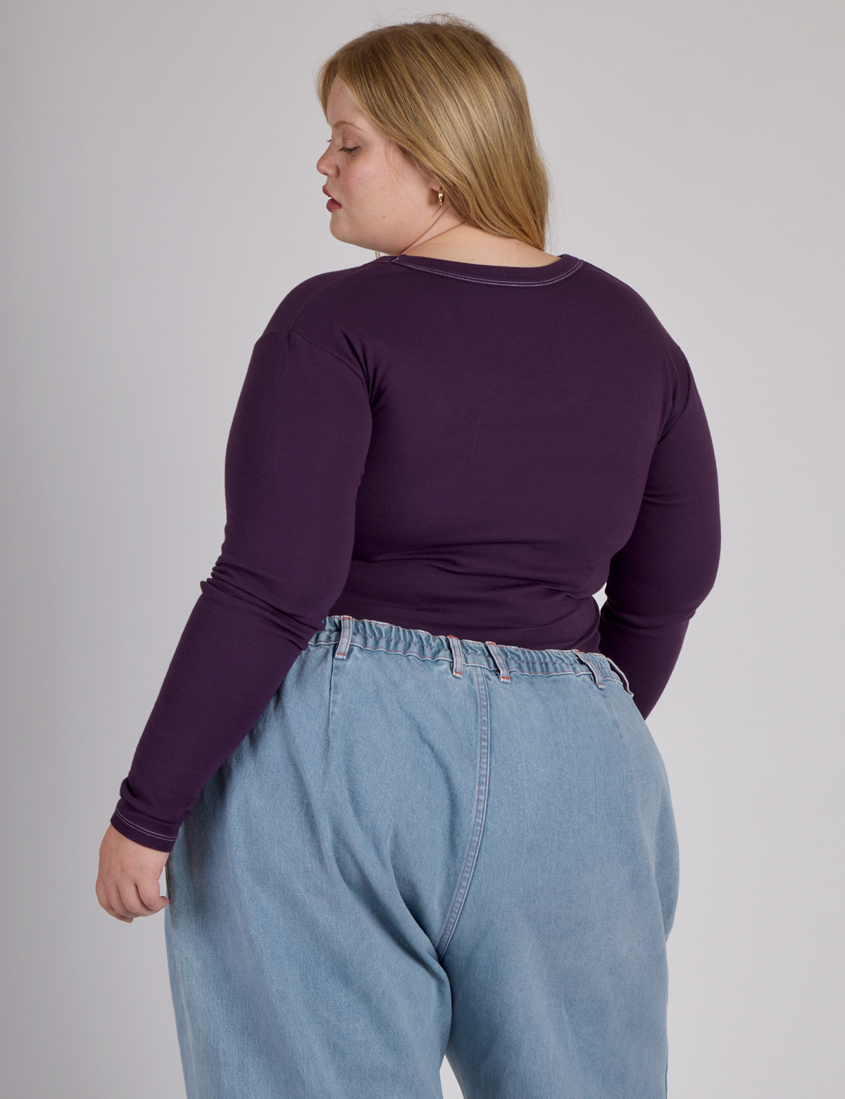 Back view of Juliet in the Nebula Purple Long Sleeve Porthole Tee