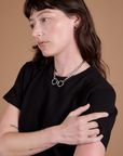 Angled front view close up of Burly Tee in Basic Black on Alex