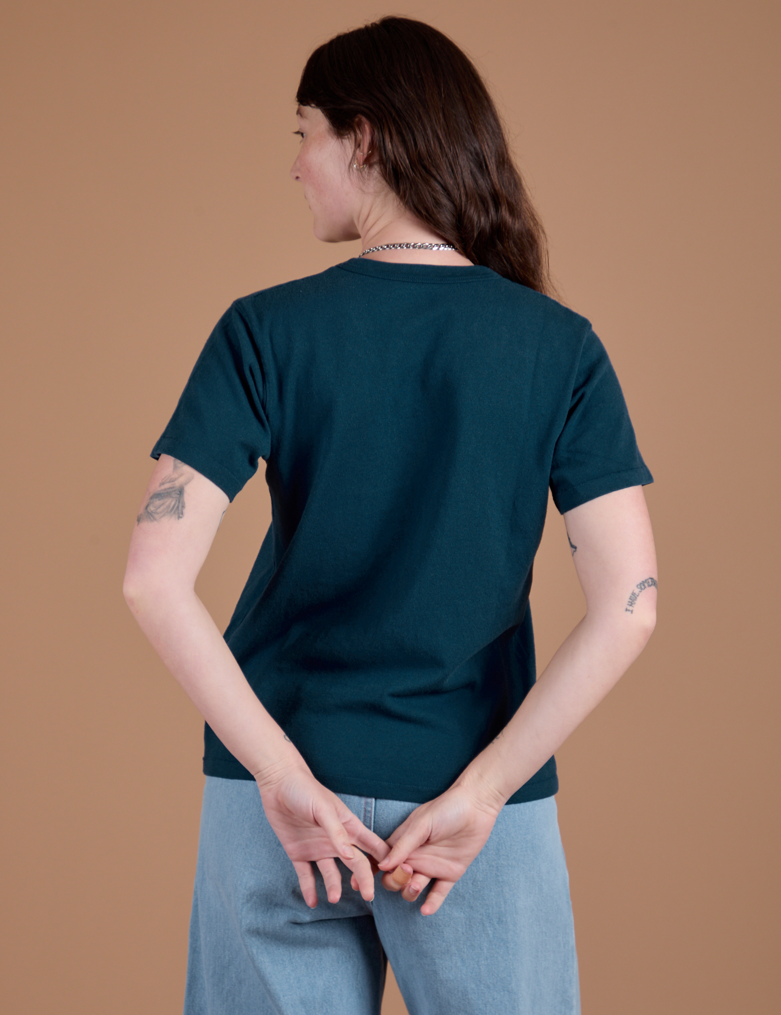 Burly Tee in Lagoon back view on Alex