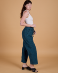 Side view of Corduroy Drop Pocket Cargo Pants in Lagoon and Cropped Tank in Vintage Tee White on Alex