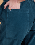 Close up of Alex's hand in the back pocket of Corduroy Drop Pocket Cargo Pants in Lagoon