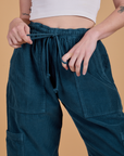 Corduroy Drop Pocket Cargo Pants in Lagoon close up on Alex