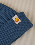Ribbed Beanie in French Blue close up sun baby tag
