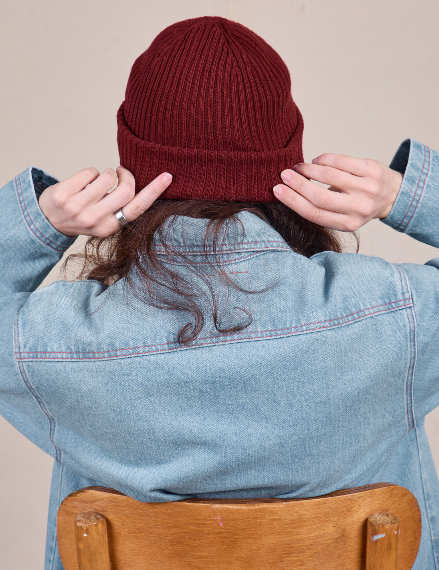 Back view of Ribbed Beanie in Red Wine on Alex